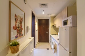 Design Studio | Private kitchen | Fridge, microwave, oven, stovetop - GreenFuture - Contemporary Studio Amidst Top Places in JVC (Dubai)