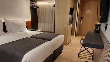 Premium bedding, down comforters, memory foam beds, minibar