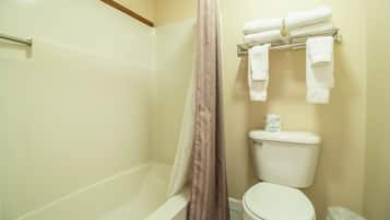 Bathtub, hair dryer, towels