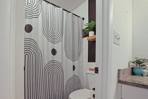 Bathtub, hair dryer, towels, soap