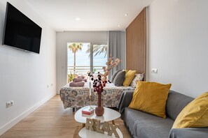 TV - Beach Front Holiday Studio Apartment with Sea Views, Private Terrace, and Wi-Fi (Fuengirola)