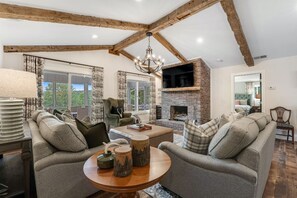 Smart TV, fireplace, table football, books