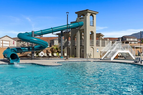 Relax by the pool and enjoy the water slide.