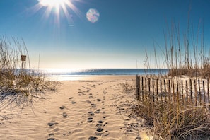 On the beach, sun-loungers