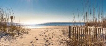 Sea Cloisters-updated, king bed; balcony with direct beach access.