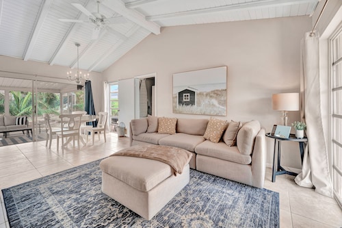 Updated tropical home with a private patio, beach gear, AC, and washer/dryer