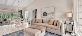 Updated tropical home with a private patio, beach gear, AC, and washer/dryer