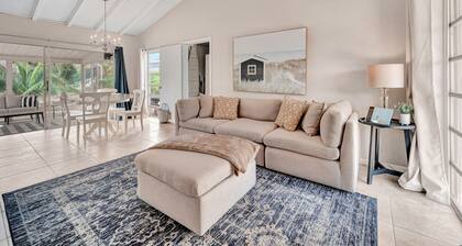 Updated tropical home with a private patio, beach gear, AC, and washer/dryer