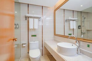 A modern bathroom with a toilet, sink, and shower. There are towels and toiletries visible. - Vienna Hotel (Longhui High-speed Railway Station) (Longhui)