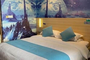 A hotel room with a bed, pillows, a nightstand, and a wall mural. - Yiru Hotel (Xinfeng) (Xinfeng)