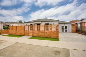 Stroll through the beautifully maintained lawn and enjoy the contemporary home's serene atmosphere.