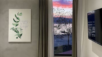 Deluxe Triple Room, Sea View | 1 bedroom, premium bedding, minibar, desk