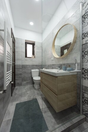 Shower, hair dryer, towels, soap