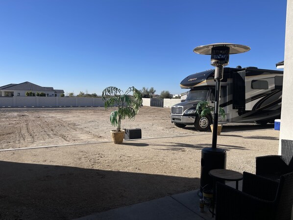 Enjoy outdoor living in a setting with a home on wheels, complete with a solar-powered roof.