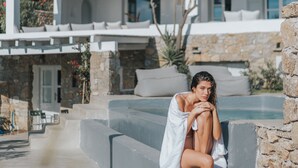 A modern white building with a pool, stone walls, and a balcony. - MyMykonos Villa II Beach Front  (Mykonos)