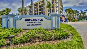 A sign for Oceanwalk Condominiums at 5300 S. Atlantic Avenue. - Pet Family Friendly condo 2 heated pools, hot tub, sauna, bocce Tennis, etc (New Smyrna Beach)