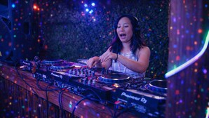 A DJ booth with Pioneer DJ equipment, surrounded by a wooden bar counter. - Event Space: Beach Club with BBQ, Speakers & Great Vibes (San Diego)