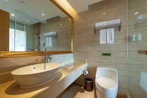 A modern bathroom with a large oval sink, a toilet, and a glass shower enclosure. - Vienna International Hotel (Yulin rongzhou bridge railway station shop ) (Rong County)