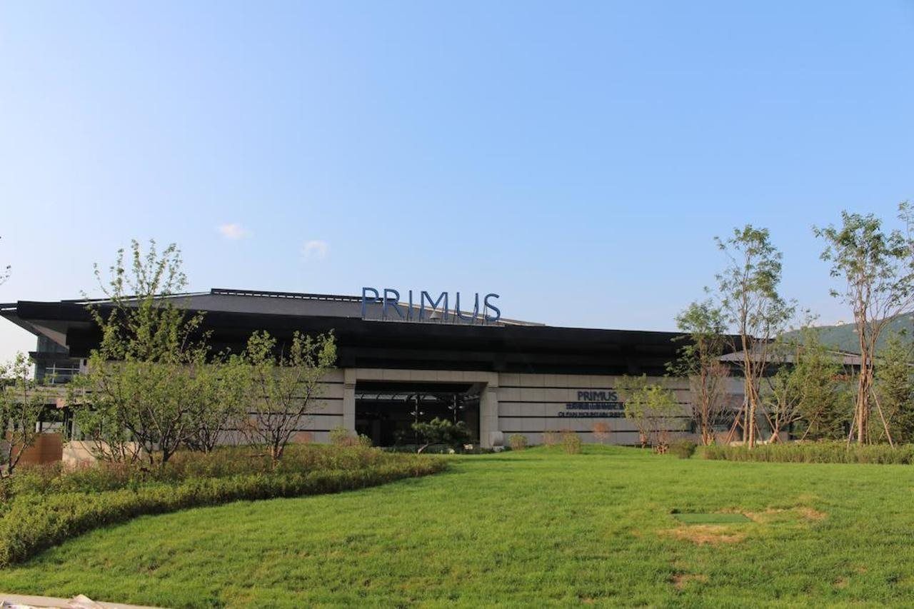 A modern building with the name 'PRIMUS' on the facade.