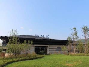 A modern building with the name 'PRIMUS' prominently displayed on the facade.