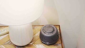 A DOHM device and a lamp on a wooden surface.
