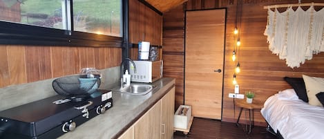 Mini-fridge, microwave, stovetop, cookware/dishes/utensils