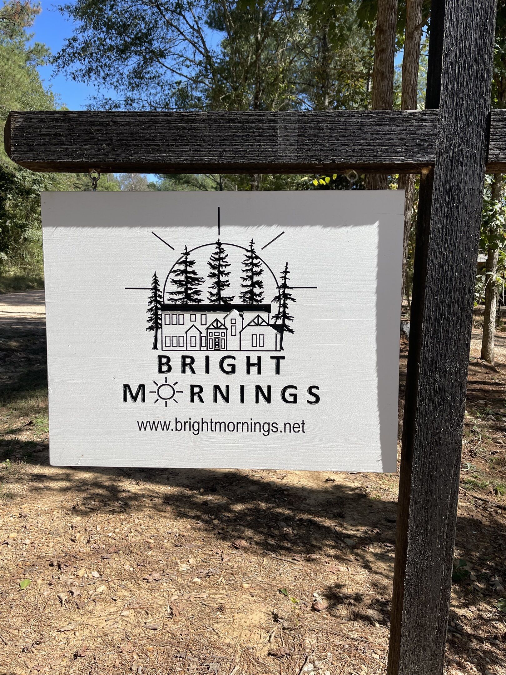 A signboard with the text "BRIGHT MORNINGS" and a website URL.