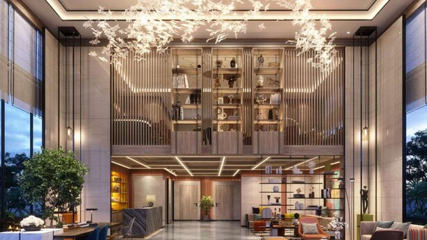 A spacious lobby with a central seating area, a reception desk, and a large bookshelf. - Ramada Encore By Wyndham Bareilly Civil Lines (Bareilly)