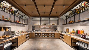 A spacious buffet area with multiple serving stations, a variety of food items, and a clean, modern design. - Ramada Encore By Wyndham Bareilly Civil Lines (Bareilly)