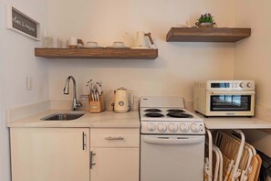 Fridge, oven, cookware/dishes/utensils