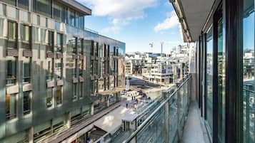 Enjoy the city view from the balcony with a clear view of the urban landscape.