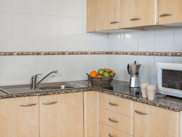 Fridge, microwave, cookware/dishes/utensils