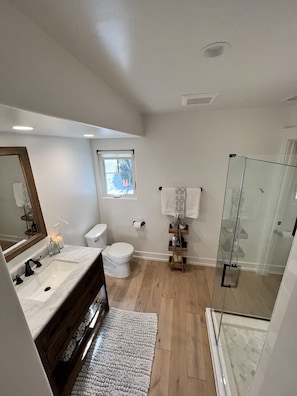 Shower, hair dryer, towels, soap