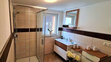 Shower, hair dryer, towels, soap