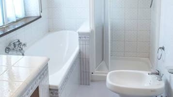 Bathtub, bidet, towels