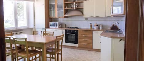 Fridge, oven, dishwasher, dining tables