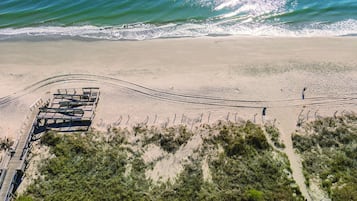 On the beach, sun loungers, beach towels