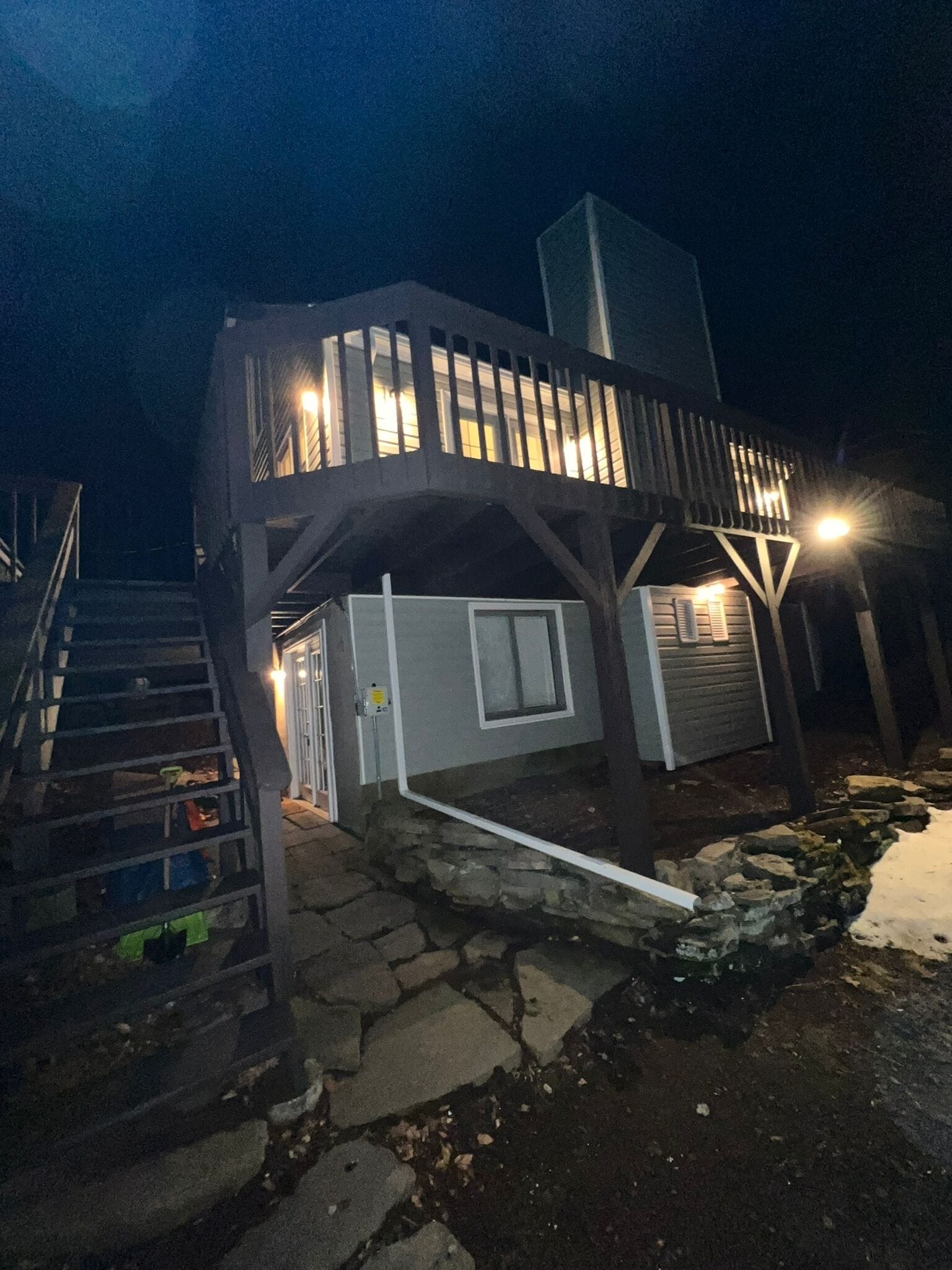 A modern two-story building with a staircase leading to the upper level.