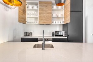 Fridge, microwave, oven, stovetop - Modern renovated El Born 2BR w/balcony, nr Arc de Triomf, by Blueground (Barcelona)