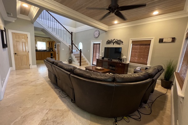 Living room with reclining coach and smart TV