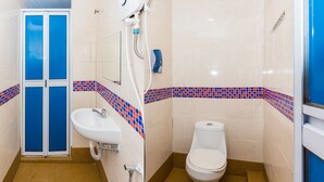 A bathroom with a toilet, sink, and shower. - Taj Grand Hotel (Malacca City)