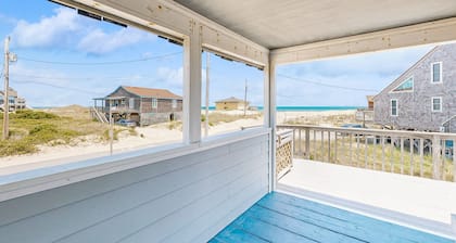 Ocean-view home steps from the beach with deck, outdoor shower, & central AC