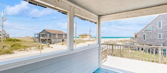 Ocean-view home steps from the beach with deck, outdoor shower, & central AC