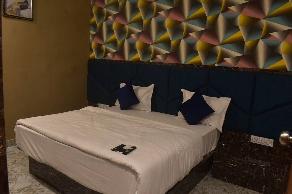 Habitación doble Deluxe | Camas extra, wifi gratis y ropa de cama
