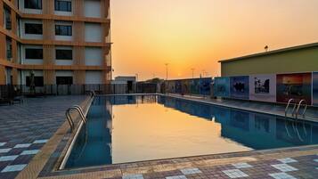 Outdoor pool, pool umbrellas, pool loungers