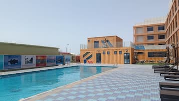 Outdoor pool, pool umbrellas, sun loungers