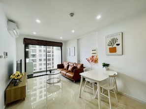 Business Apartment, 1 Bedroom | Living area | 50-inch Smart TV with digital channels, TV, Netflix