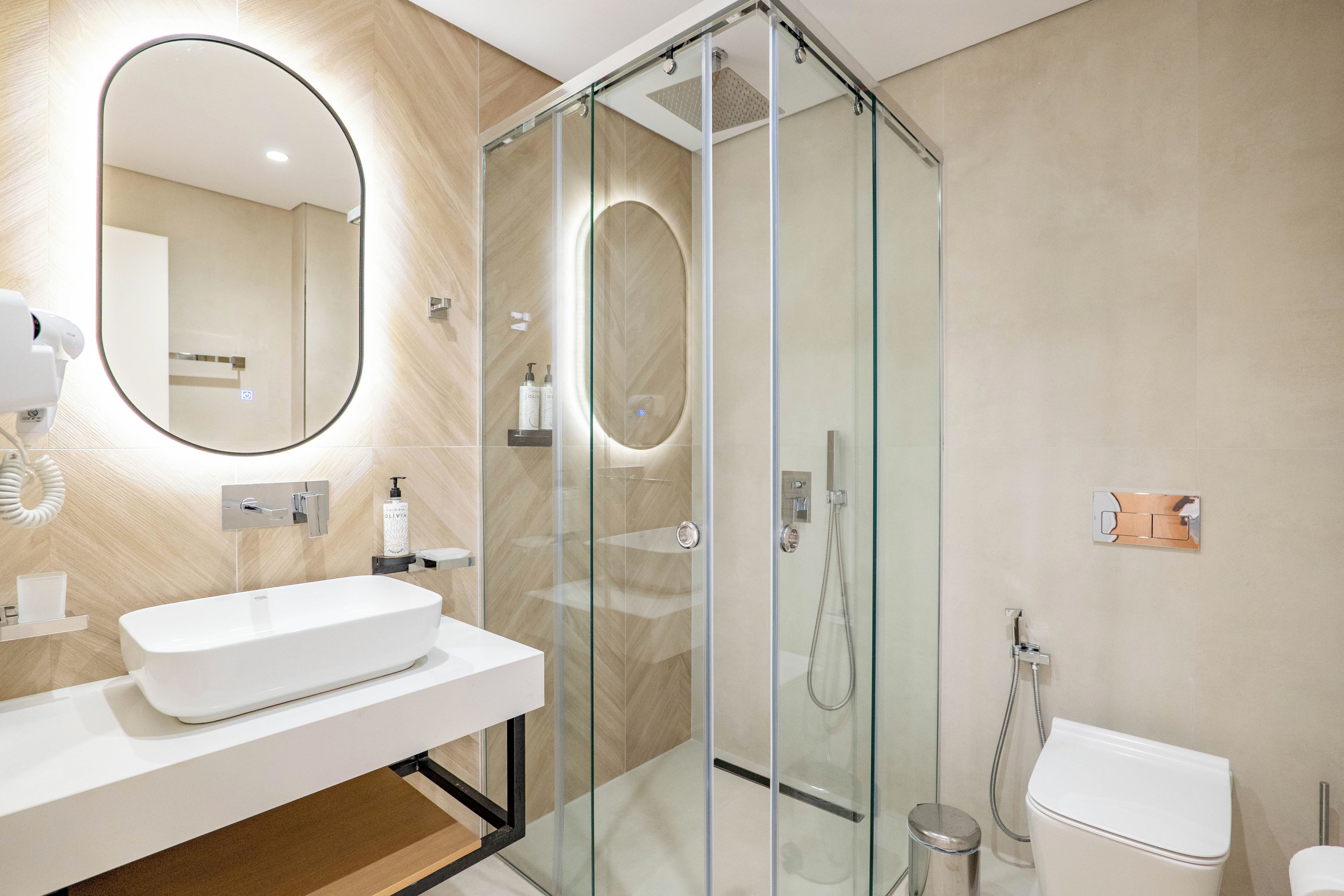 Shower, hair dryer, slippers, towels