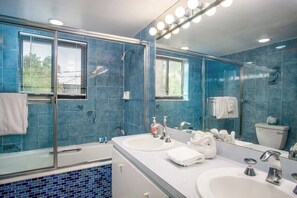 Bathtub, hair dryer, towels, soap