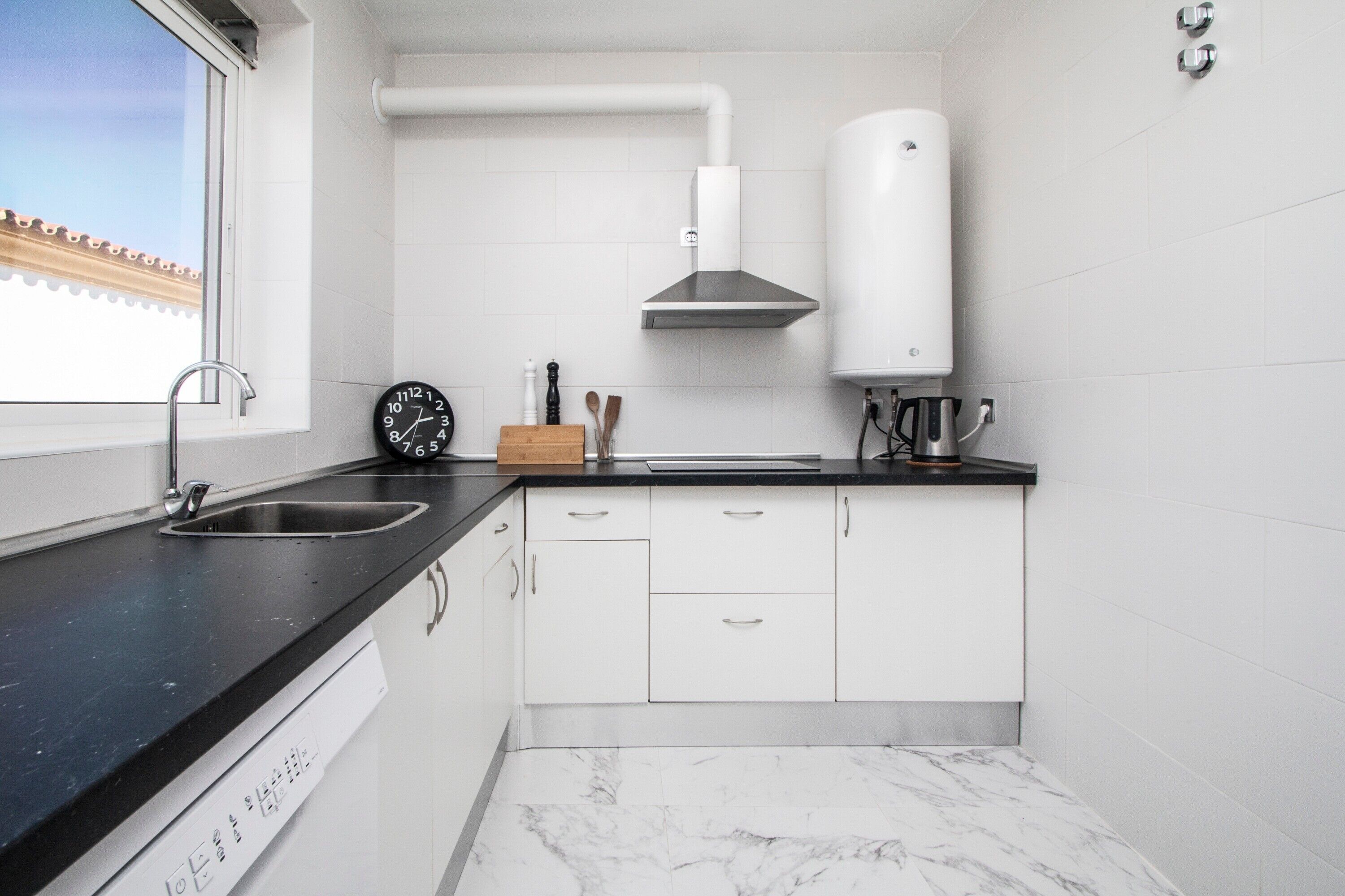 Fridge, stovetop, dishwasher, coffee/tea maker